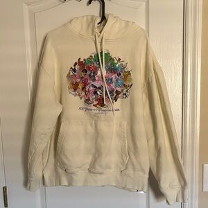 Disney 100 Years of Music and Wonder Cream Hoodie with Character Graphics